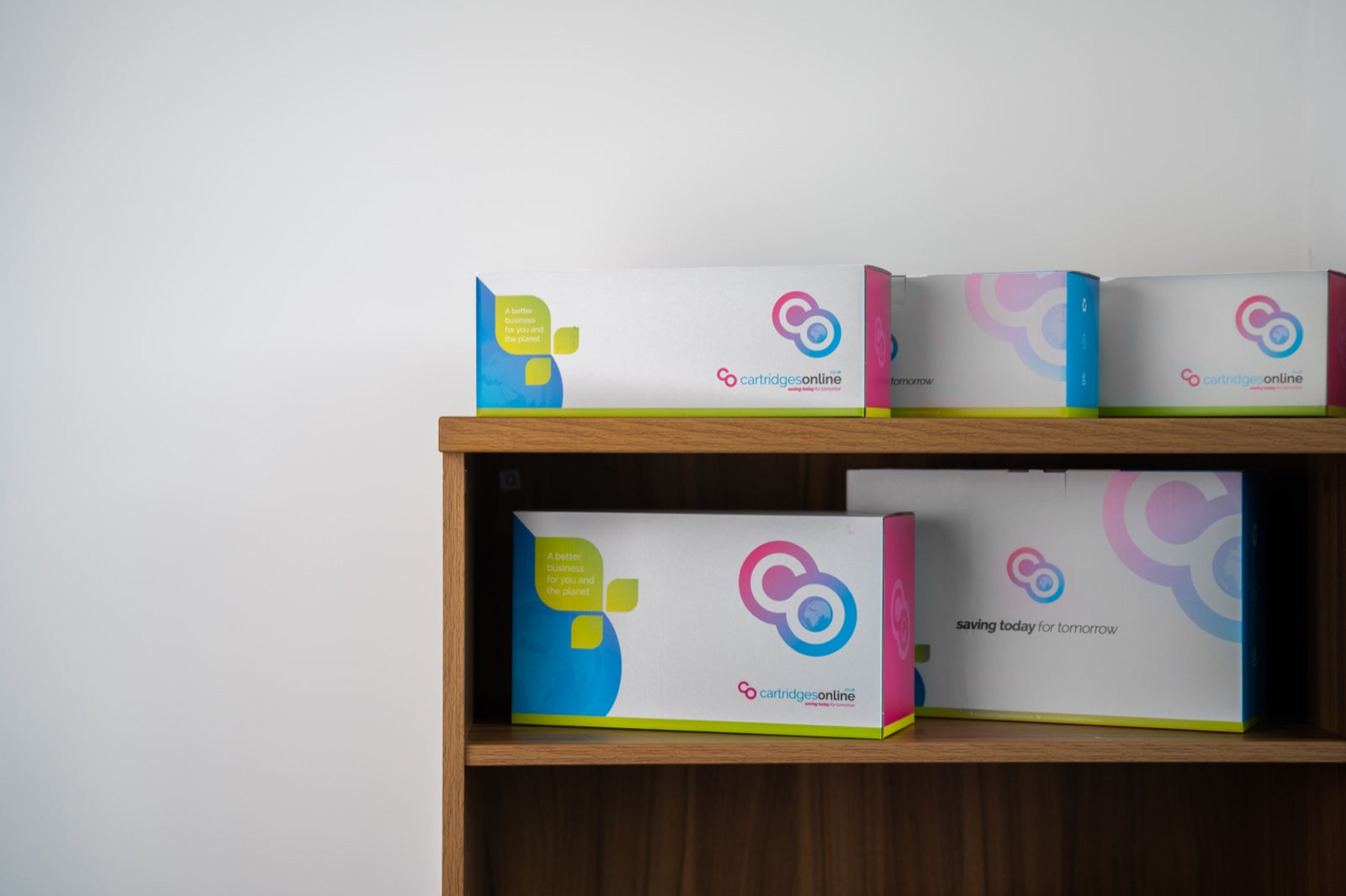 Cartridges Online branded boxes ready for dispatch on stockroom shelving